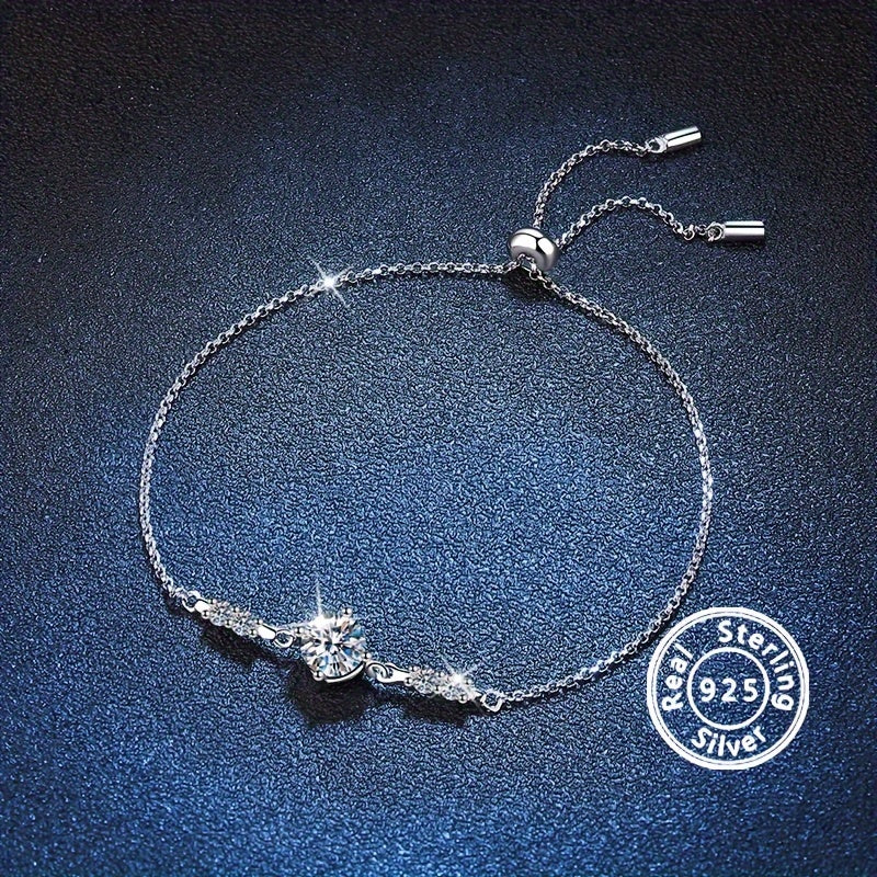 This elegant bracelet features a 1 carat Moissanite stone set in a 925 sterling silver setting. It is perfect for weddings, parties, anniversaries, or as a special gift for Easter. The bracelet weighs 3.1g/0.11oz and is a beautiful addition to any