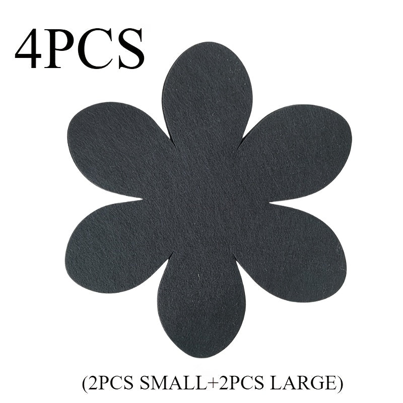 Set of 4 black petal-shaped pan pads made of non-woven, non-stick material. These pads are non-slip, anti-scalding, and provide heat insulation. They are easy to clean and made of multi-ply felt cloth.