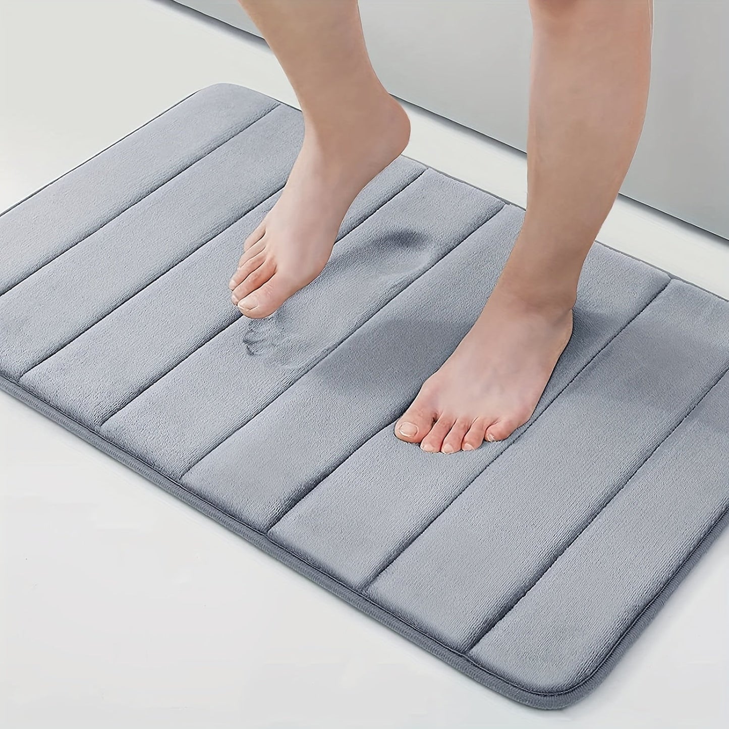 1 piece of Memory Foam Bath Mat designed for the bathroom, featuring a non-slip surface and thickened soft material that quickly absorbs water and dries fast. This machine-washable mat can also be used as a shower mat, living room or bedroom entrance