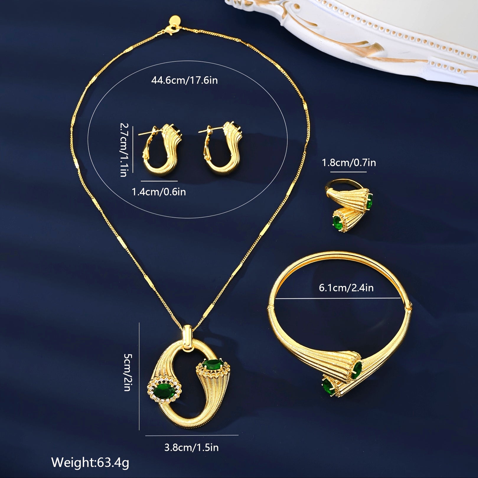 4-Piece Gold-Toned Copper Jewelry Set with zirconia Accents – Chic and stylish design perfect for any occasion. Makes the perfect Valentine's Day gift. Set includes a necklace, earrings, and two bangle-style ornamental pieces.