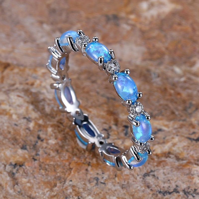 Infinity ring made of high-quality S925 sterling silver with round opal pave, suitable for both men and women to complement everyday outfits. This jewelry piece weighs 2.5g/0.09oz.