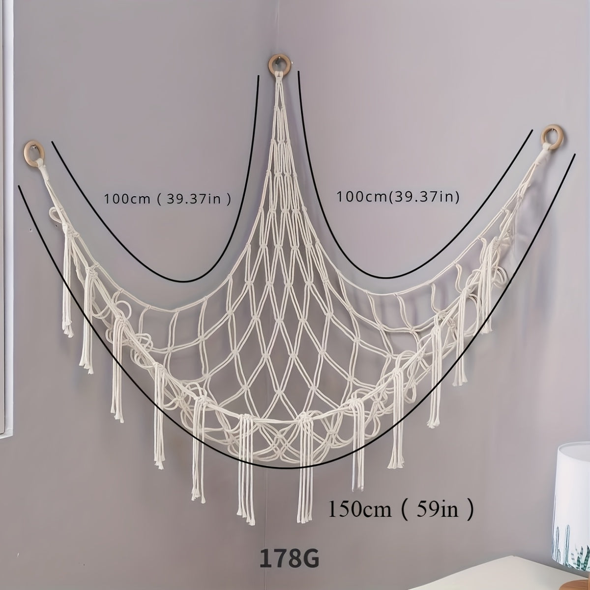 Versatile hanging storage net for youngsters' room or living room decor with cute design. Available in black, white, pink, and light blue. Measures 100x100x140cm. Lightweight fabric with a decorative star design.