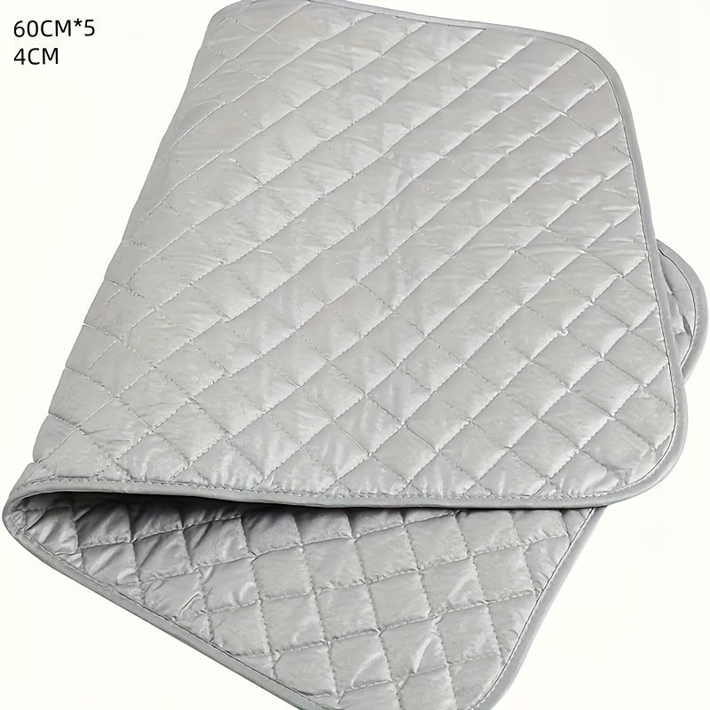 A non-electric silver-coated laundry pad that is heat resistant and portable, featuring thick cotton padding. This ironing mat can be used for dryer, washer, travel, hotel, and dorm use. It is a multipurpose accessory for ironing, and comes in a set of 1