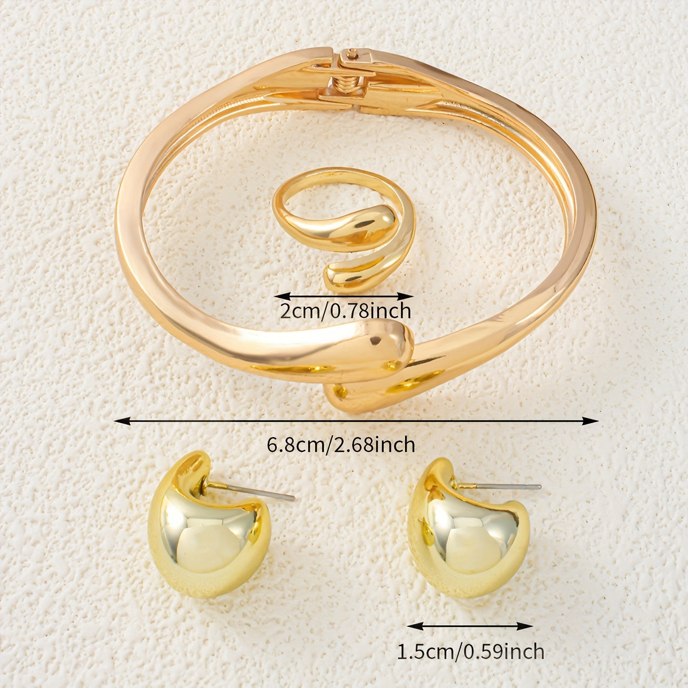 A set of women's jewelry, including earrings, a ring, and a bracelet with a spring design, ideal for everyday elegance.