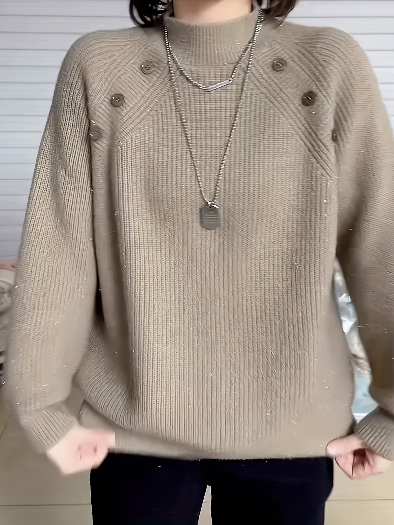 Polyester crew neck sweater for women with long sleeves, button detail, and regular fit for fall/winter.