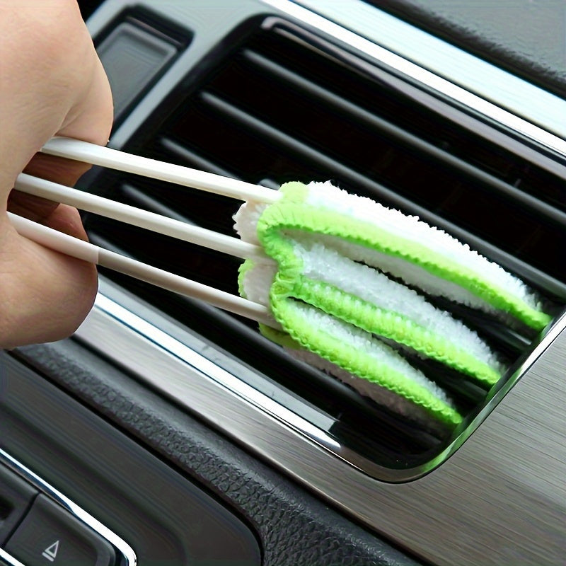 Detachable and washable car vent cleaning brush for hard-to-reach corners and door partitions.