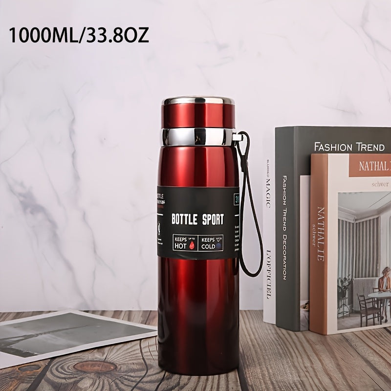 Stainless steel 1000ml vacuum insulated water bottle with portable strap, BPA-free, keeps hot/cold for sports and outdoor activities, hand wash only.