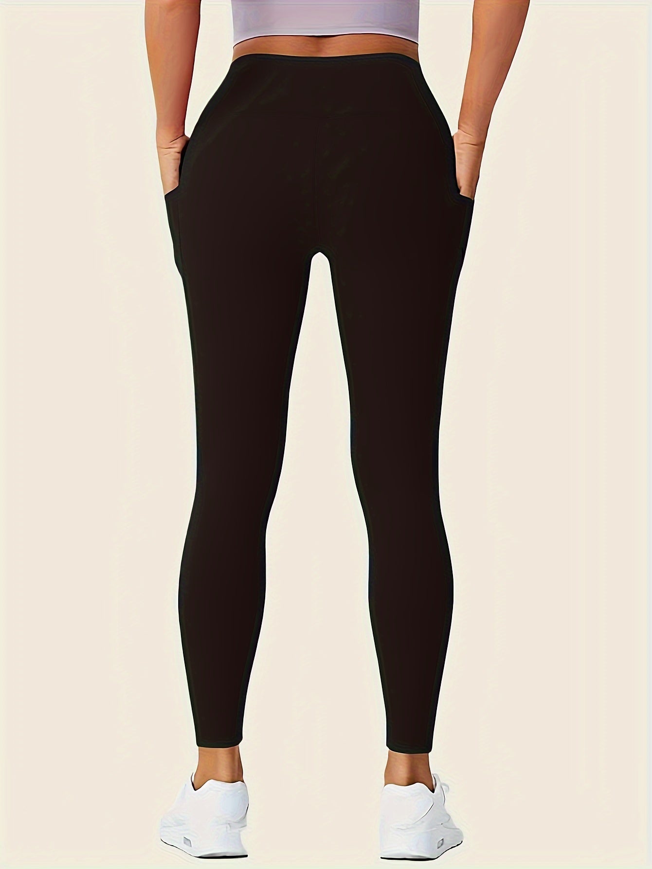 Stretchy high-waisted leggings with pockets for comfort.