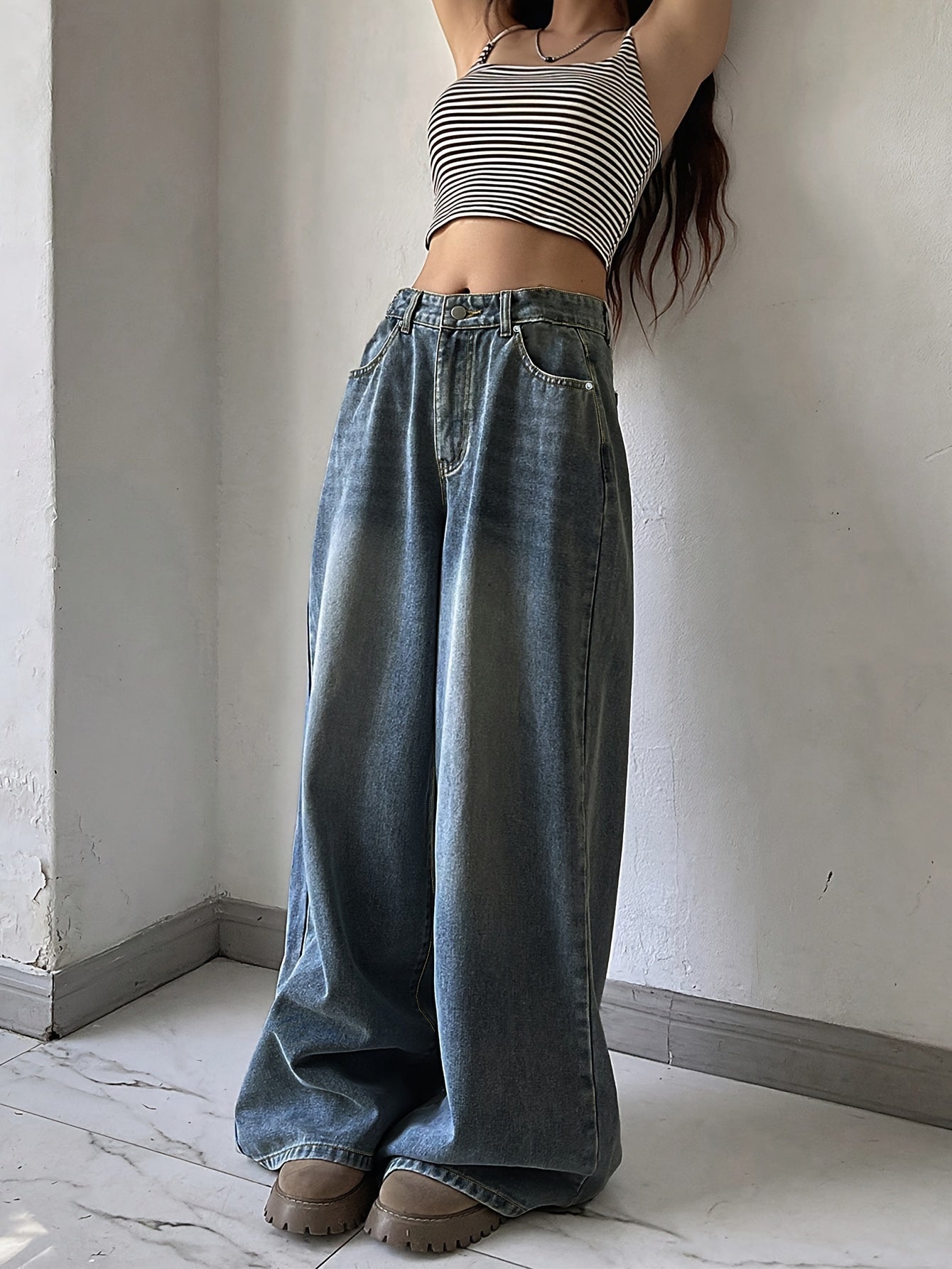 Water washed blue extra long wide leg jeans for women, perfect for casual autumn wear.