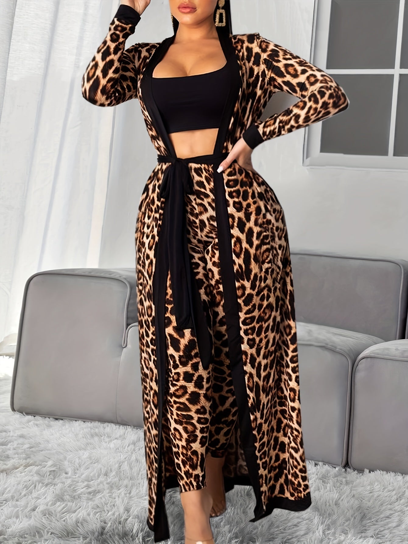 Women's loungewear set includes leopard print robe with belt, strapless crop top, and pants.