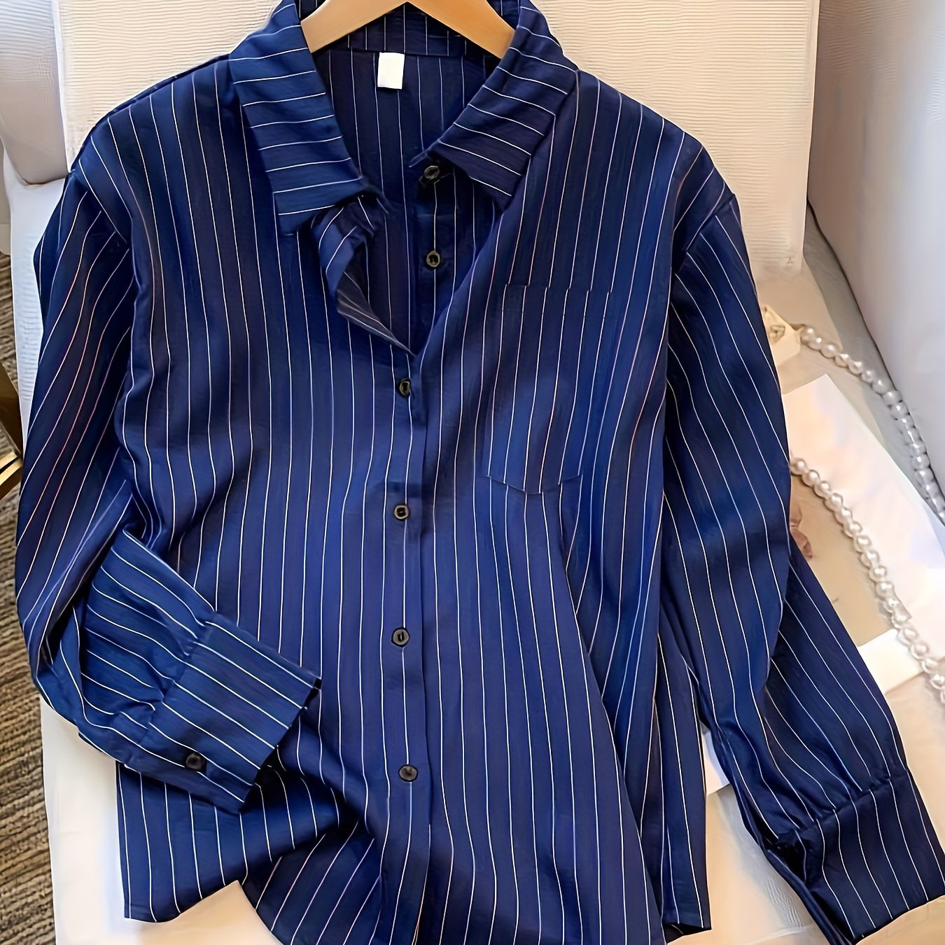 Striped button front shirt with pockets, perfect for spring and fall.