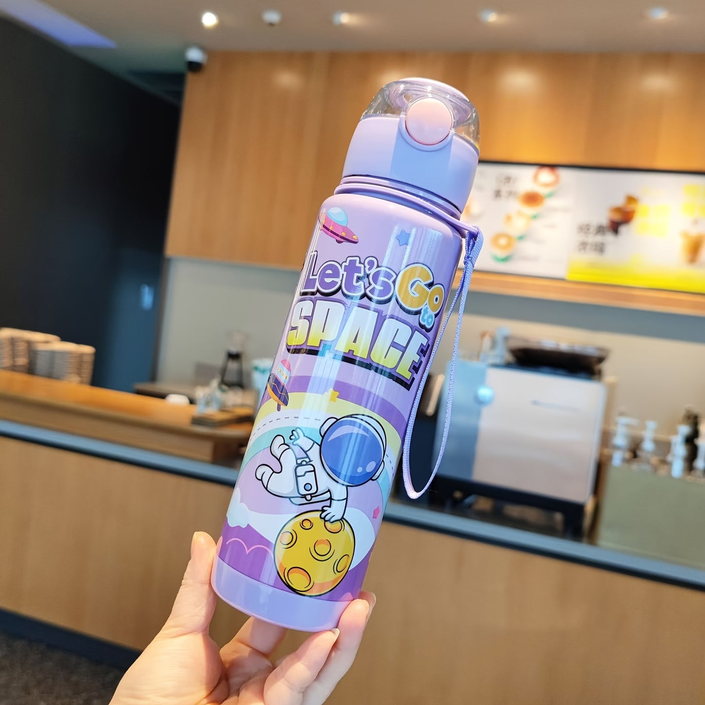 Leak-proof and space-themed 700ml water bottle made from BPA-free, high-temperature resistant PC material, ideal for outdoor activities. A perfect holiday gift.