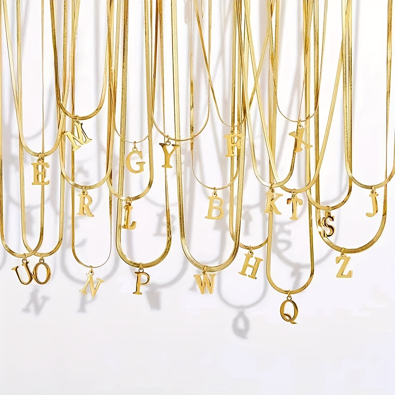 26 alphabet letter pendant chains, 18K golden plated stainless steel necklaces for women, perfect for everyday wear and gifting, featuring a versatile and elegant design.