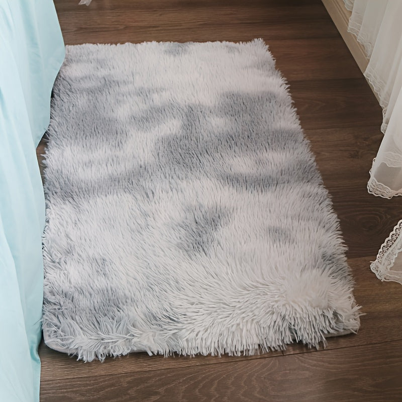 Soft and luxurious light gray plush floor mat with non-slip backing for ultimate comfort and safety. Made of ultra soft, fluffy polyester, this mat is perfect for use in the bedroom, bathroom, or living room. It is machine washable, making it easy to