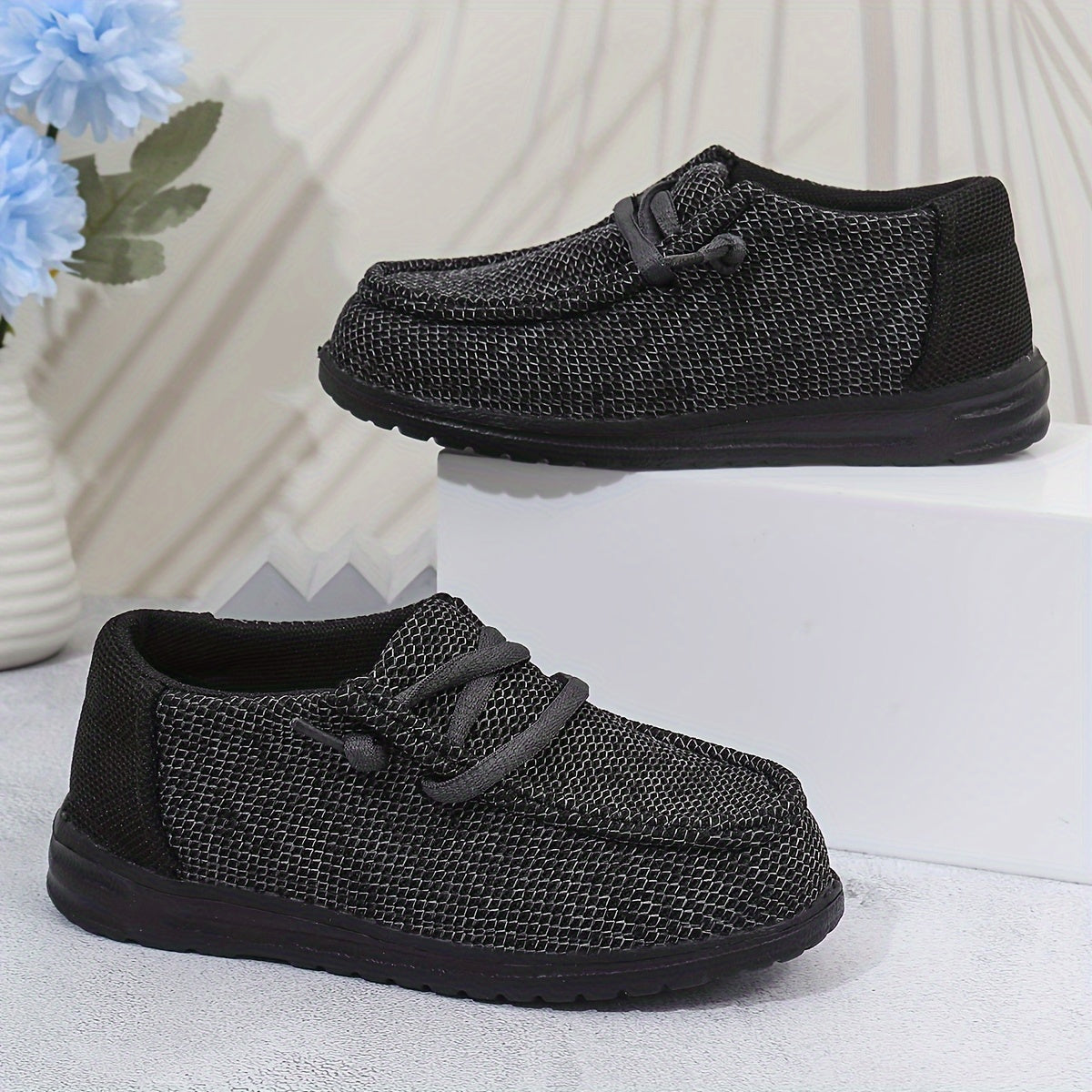 Vintage-inspired slip-on canvas shoes for boys with cushioned sole, perfect for all seasons.