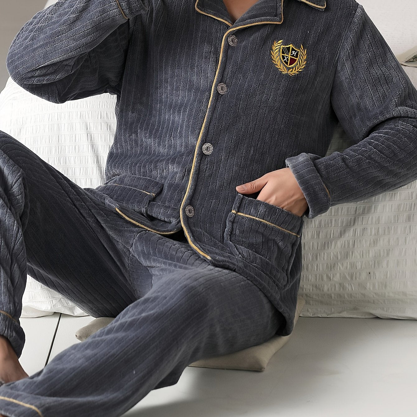 Men's cozy flannel pajama set with lapel collar top and solid color loose fit pants made from 100% polyester knit fabric for fall/winter.