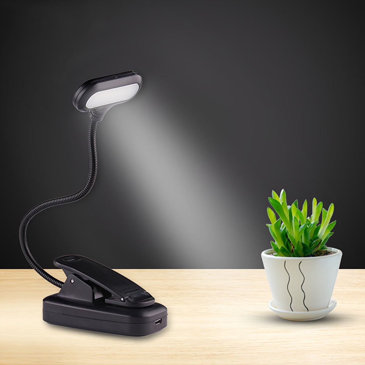 Portable battery-powered clip-on book light with a flexible hose, ideal for reading in small spaces or as a bedside night light.