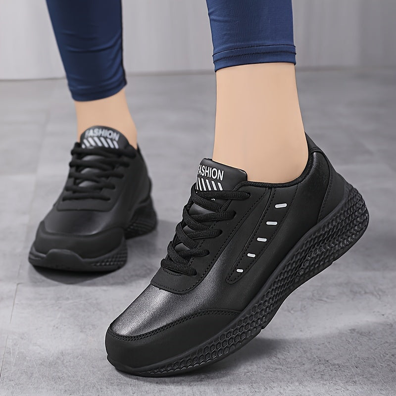 Black platform sneakers for women with lace-up design and comfortable fit, suitable for outdoor activities.