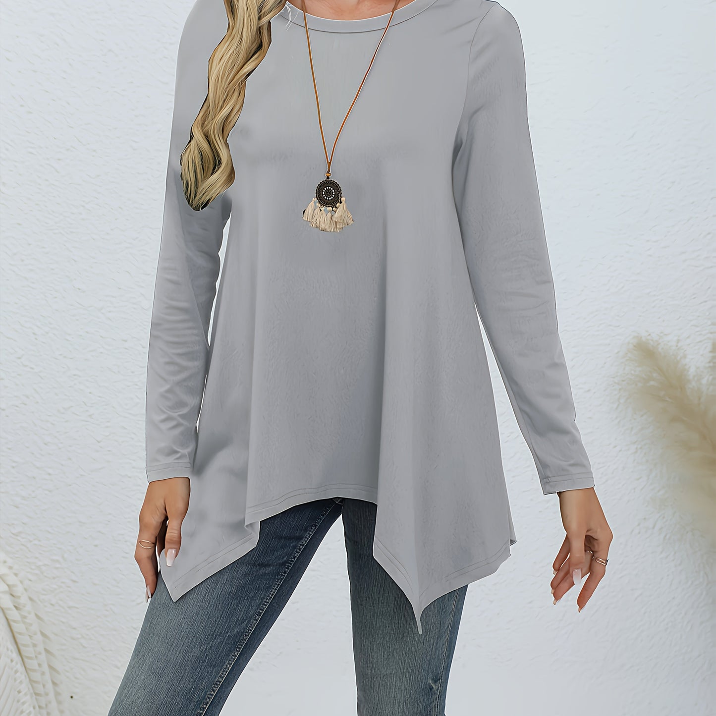 Comfortable lounge tops for women, including round neck long sleeve tunic with asymmetric hem.