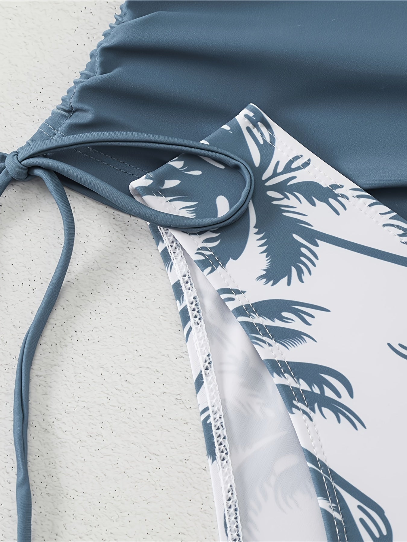 Padded bra swimsuit with palm tree print.