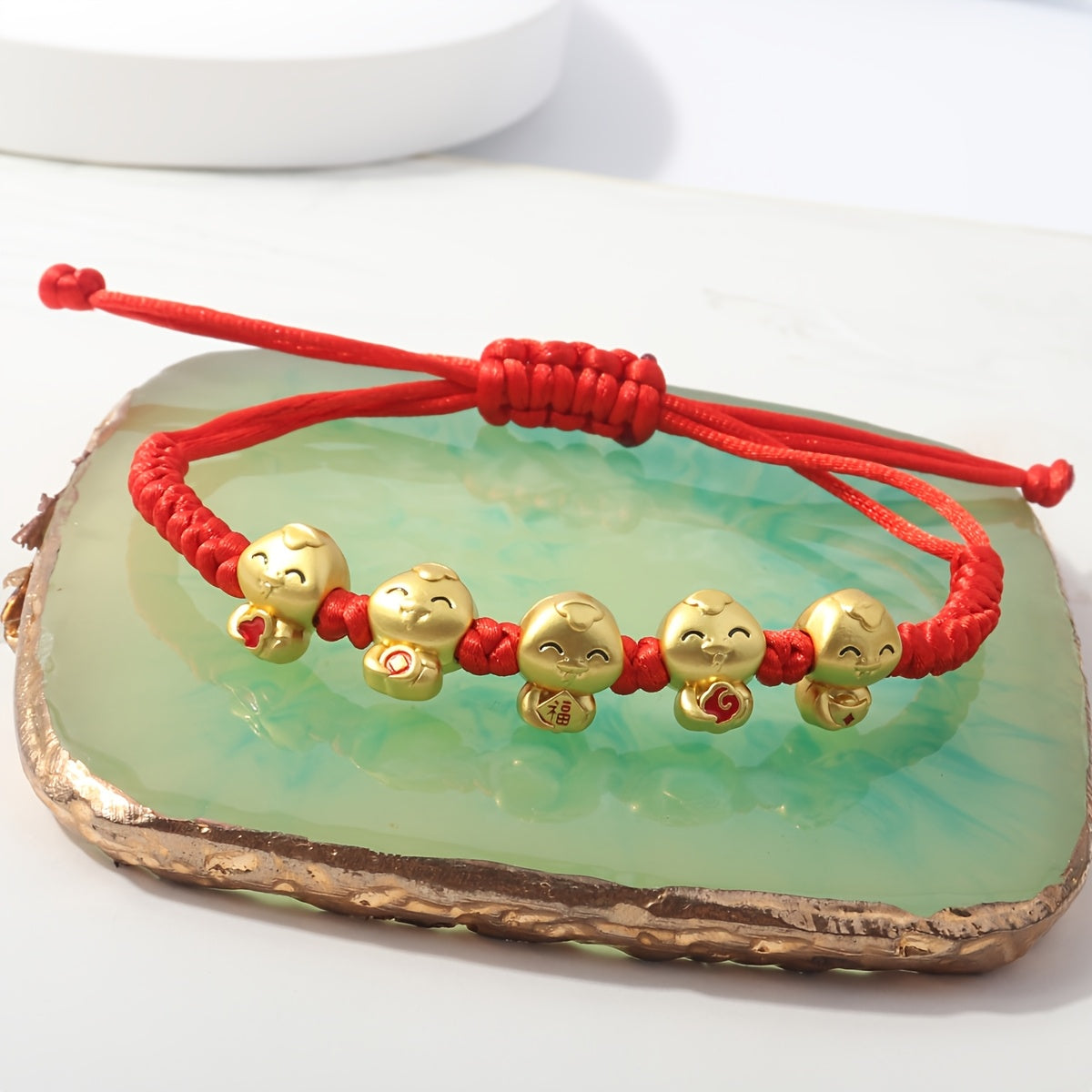 Incorporating a Chinese style and adorned with red thread jewelry, the 2025 Lucky Snake Symbol Red Thread Woven Bracelet showcases five snake pendants, creating a one-of-a-kind piece. Perfect for gifts on birthdays, Valentine's Day, Mother's Day, or as a