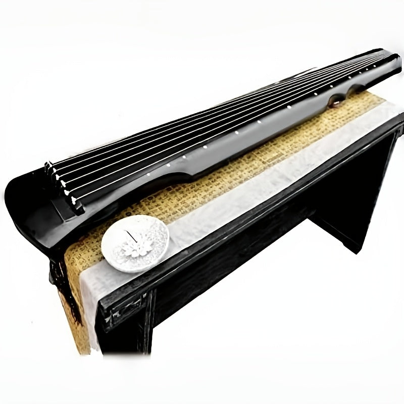 NUNUGGS Traditional Chinese Guqin made of solid paulownia wood with elegant black finish and golden tone tuning pins. Suitable for beginners, photo props, and antique interpretation.