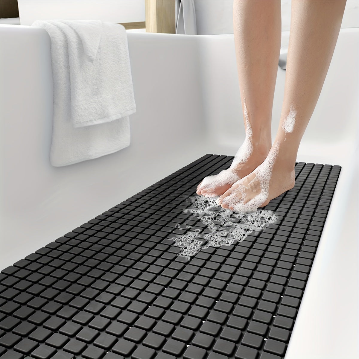 Make your shower experience safer and more comfortable with the DEXI Extra Long Non-Slip Bath Tub Mat. Measuring 39.88cm x 100.08cm, this gray PVC mat features suction cups and drainage holes for added security. Machine washable and perfect for gifting