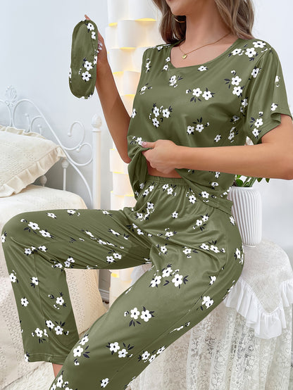 Women's floral pajama set with short sleeve top and elastic waistband pants.