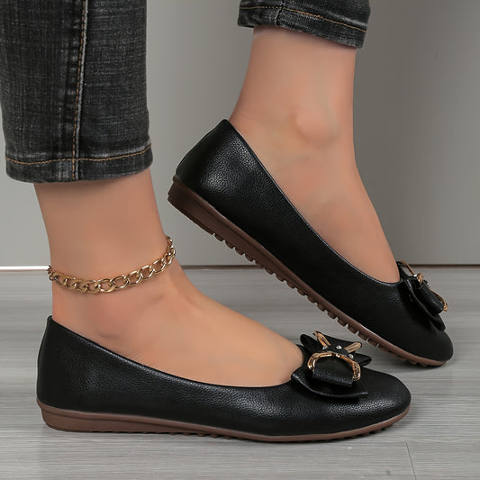 Casual flats for women with bow and rhinestone detail, round toe comfort, slip-on style, solid color.