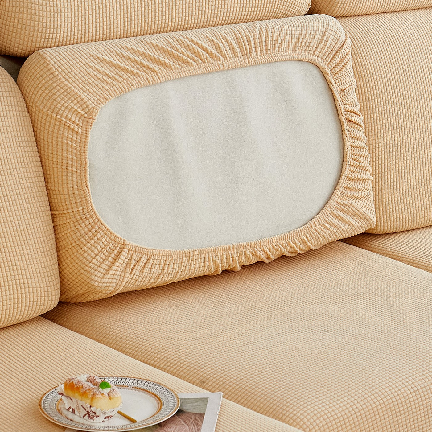 Durable sofa cover protects furniture from spills and stains.