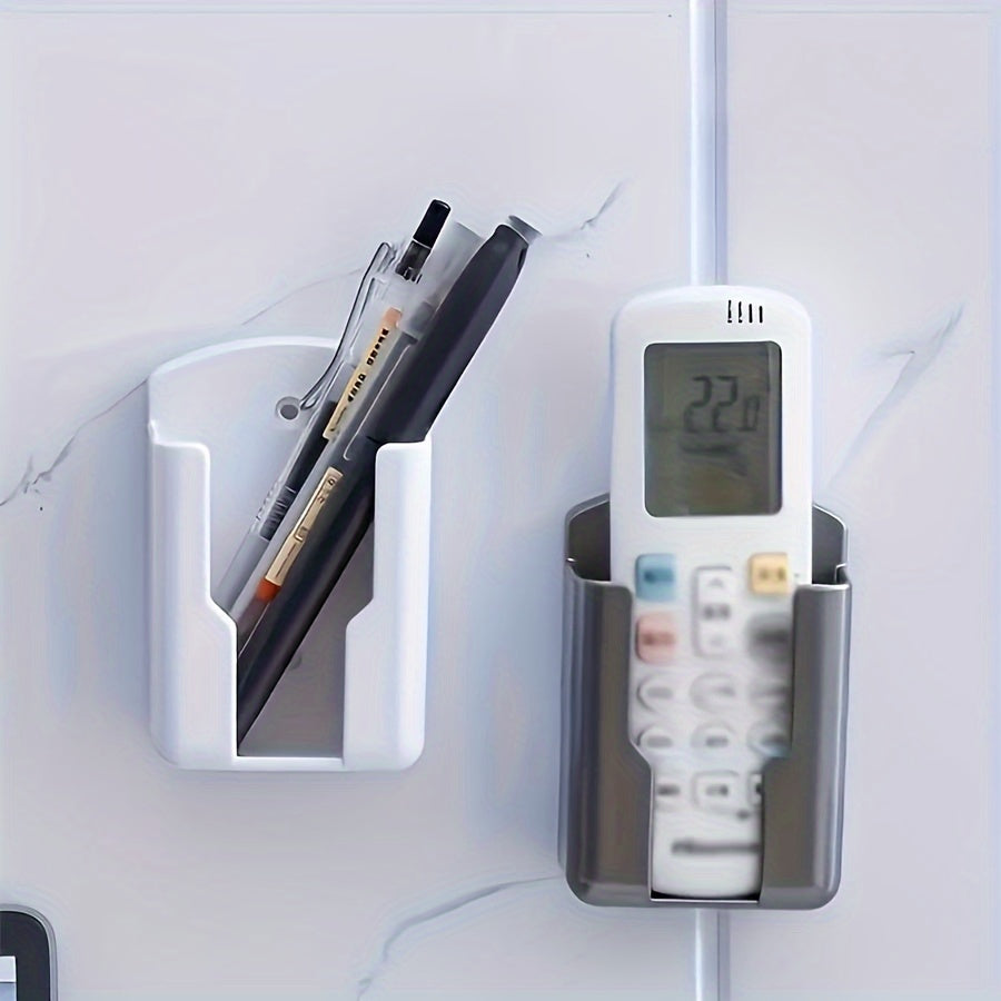 Wall-mounted storage organizer for TV, air conditioner, and remote controls - holds 2 pieces. No-drill adhesive holder for phone chargers and more. Ideal for organizing storage boxes.