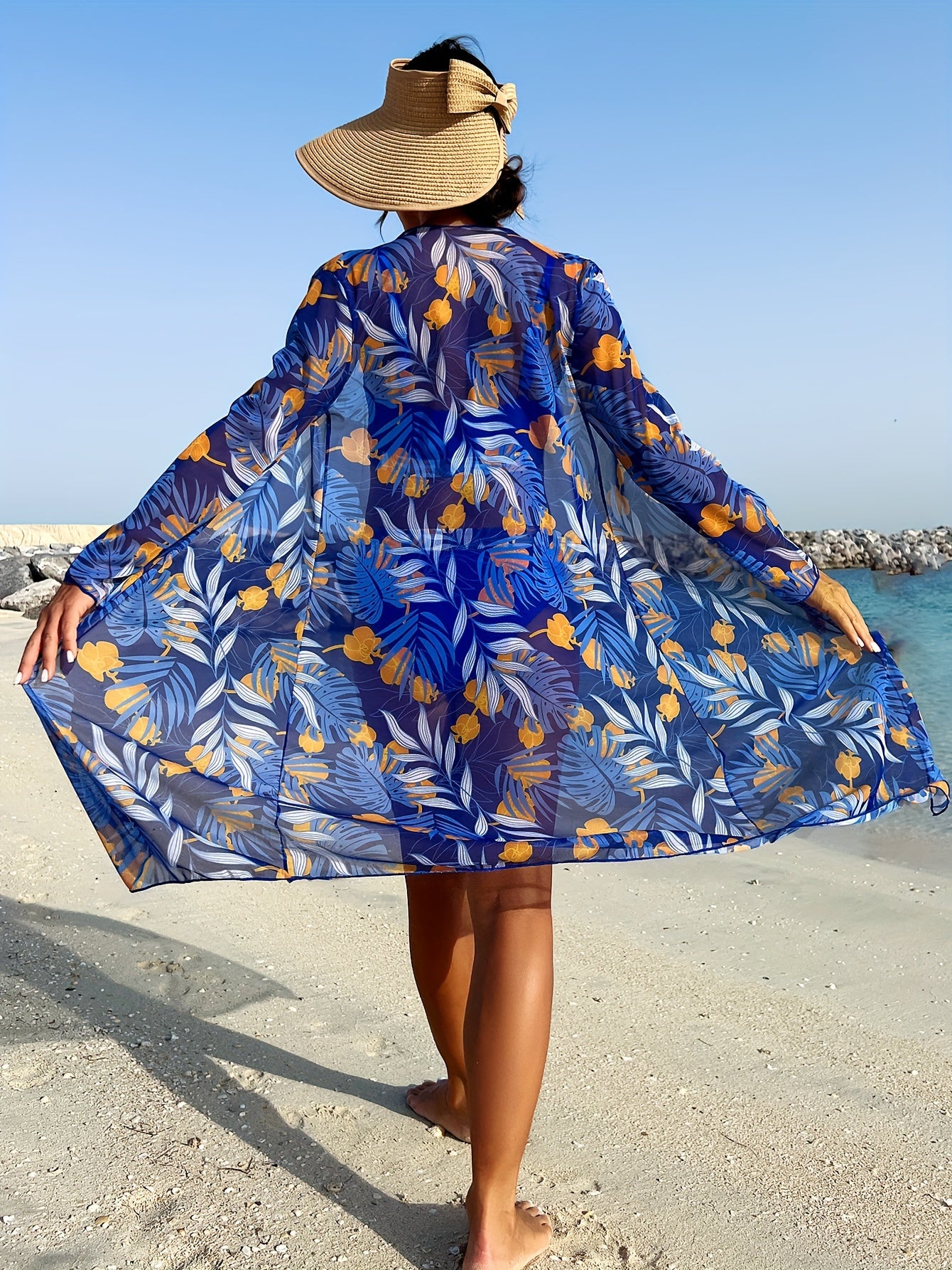 Tropical plant print cover-up set with sun protection for women.