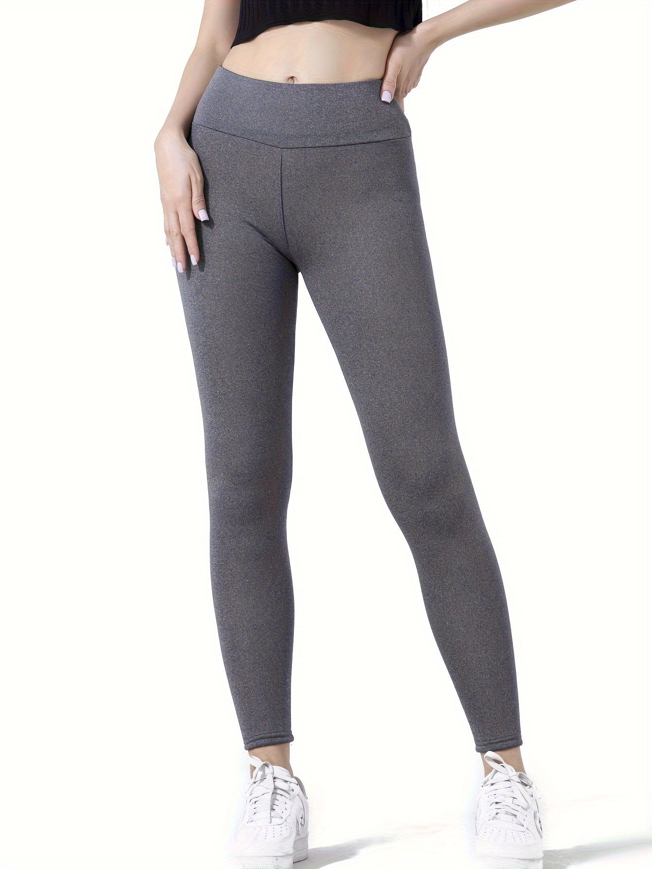 High-waist shaping leggings for women, plush-lined for warmth, in heather gray. Ideal for fall and winter. Made from polyester and elastane blend, must be hand or dry cleaned.