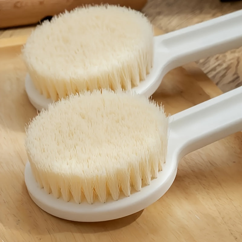 Long handle bath brush with soft bristles for exfoliating massages and cleaning.