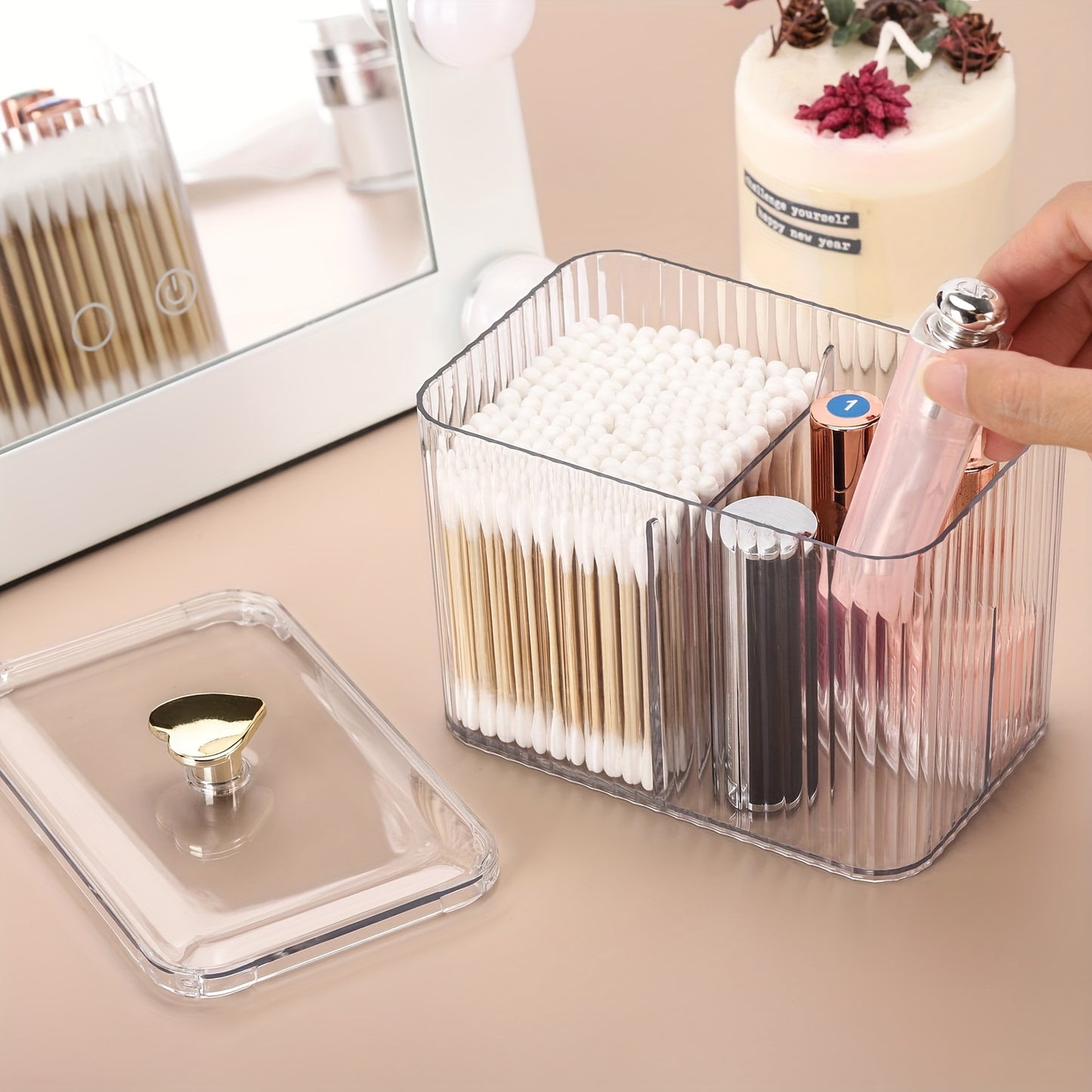 Clear plastic Qtip holder with 3 sections for cotton swabs, pads, and balls. Ideal for vanity storage, lightweight and space-saving.