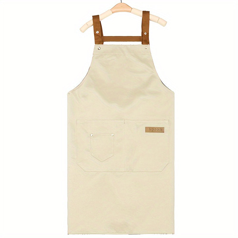 Unisex canvas apron with pockets, adjustable strap, ideal for coffee shops, restaurants, kitchens, and various other professions. Made of durable 240G/M² woven fabric with a protective