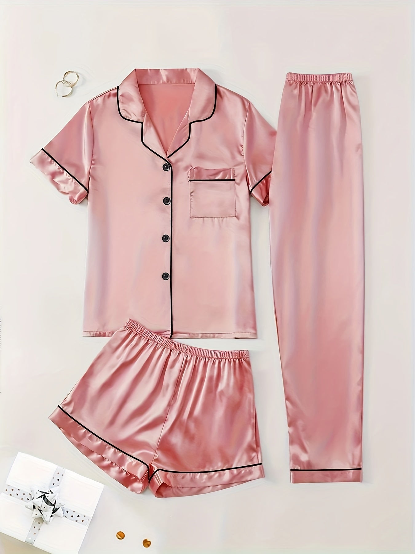 3-piece summer satin pajama set for women featuring collared shirt, long pants, and shorts. Made of 95% polyester and 5% elastane. Available in sizes S-XL.