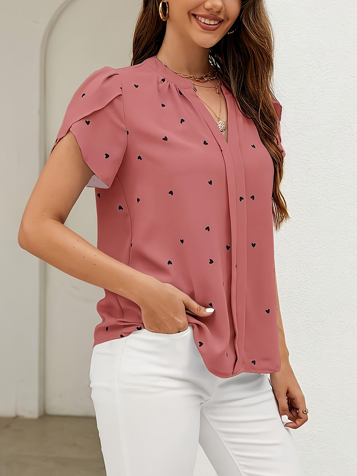 Light blue heart pattern V-neck blouse for women in casual polyester/spandex, available in petite sizes, machine washable, everyday fashion with smooth texture.