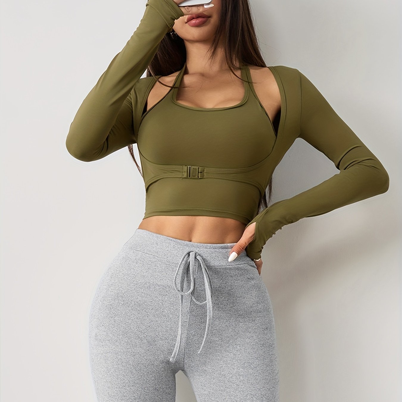 Women's long sleeve yoga top with built-in bra, seamless sports crop top for fall and winter seasons.