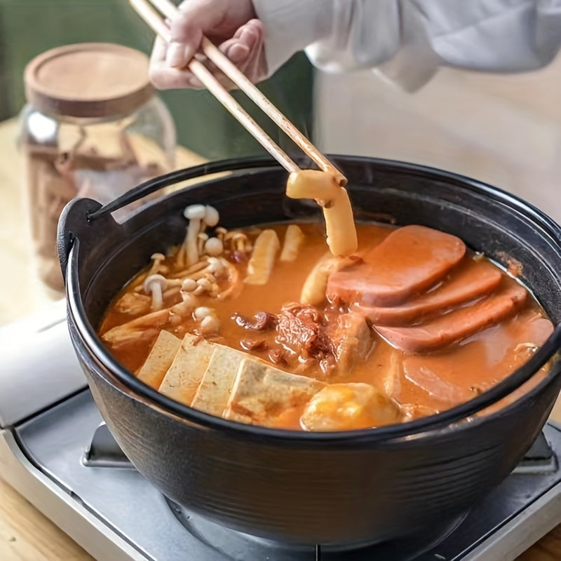 Japanese stew pot, featuring a cast iron construction that is handmade without any coating. This pot is thickened and high temperature resistant, making it perfect for traditional Japanese dishes like sukiyaki and hearty soups. Enjoy the old-fashioned