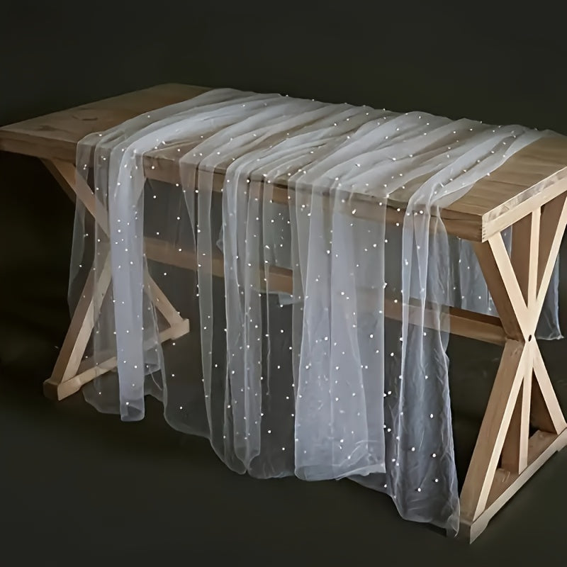 Elegant pearl bead tulle table runner, perfect for weddings and parties. Can also be used as a chair sash or backdrop drape. Made from 100% polyester fabric with delicate bead detailing.