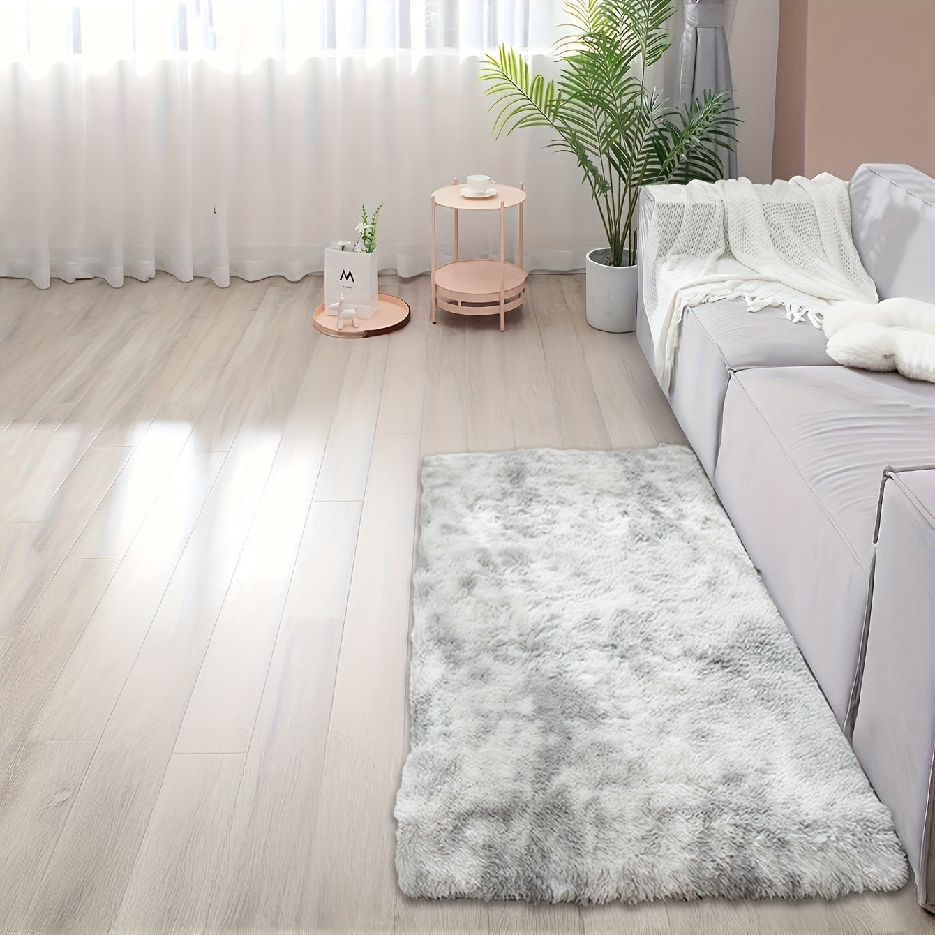 Soft and fluffy rectangle area rug perfect for your bedroom. This plush carpet is thick and non-slip, making it ideal for your living room. Made with machine-made polyester fiber, this low-pile rug is washable for easy cleaning. Perfect for indoor use.