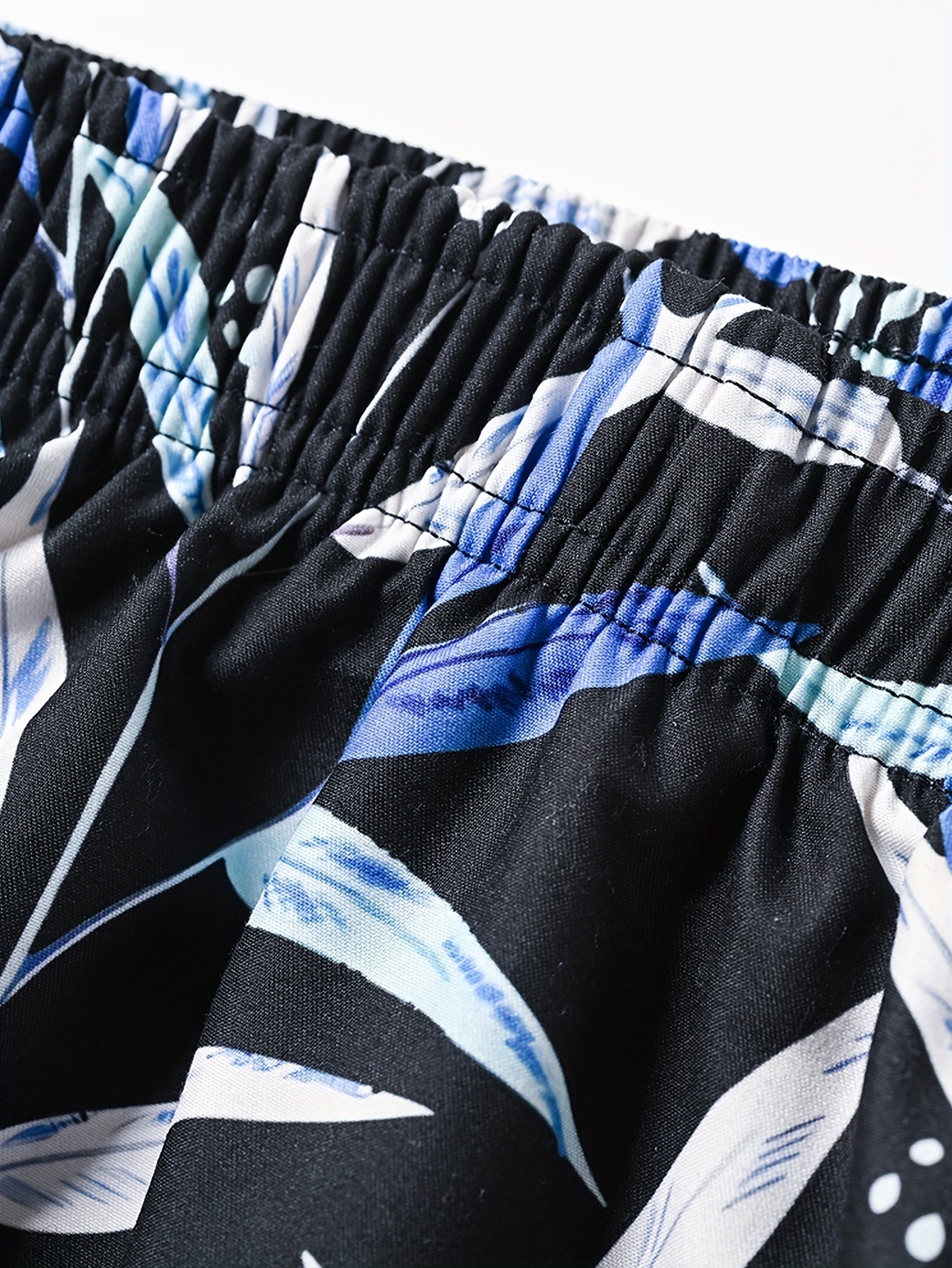 Tropical trees print board shorts for big and tall men, perfect for summer and outdoor sports.