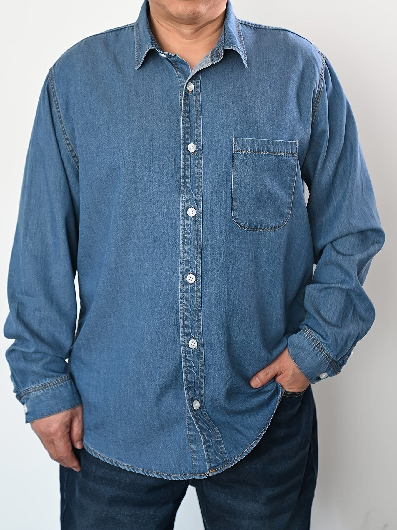 Men's plus size denim shirt, perfect for outdoor activities in spring and fall. Stylish, loose fit and breathable.