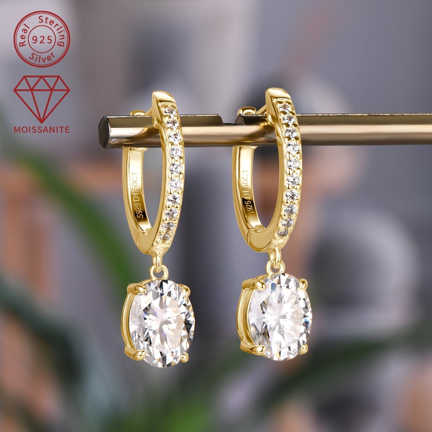 These exquisite silver earrings feature a pair of synthetic moissanite stones, each weighing 1.5ct. The main stones are 6x8mm in size, giving off a dazzling sparkle. These dangling earrings are perfect for adding a touch of glamour to any outfit.