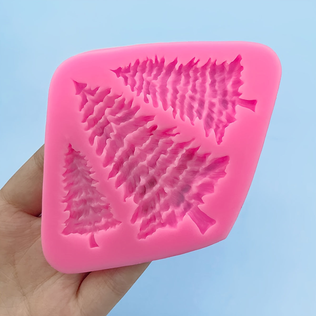 Silicone mold for a Christmas tree pine tree, perfect for making 3D fondant, pudding, chocolate, candy, desserts, gummy treats, handmade soap, aromatherapy candles, plaster, polymer clay, and ice cubes. Ideal for baking, cake decorating, and other