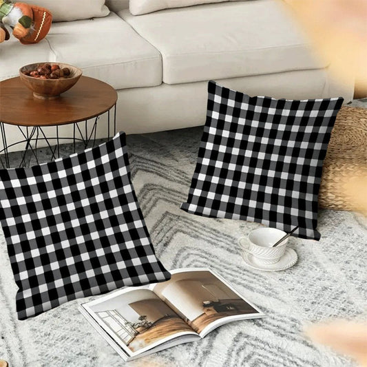 Two-pack of contemporary black and white checkered flannel pillow covers measuring 45.72x45.72 cm. These machine washable, zippered square cushion cases are perfect for use on your sofa, bed, or outdoor furniture in any season. Please note that pillow