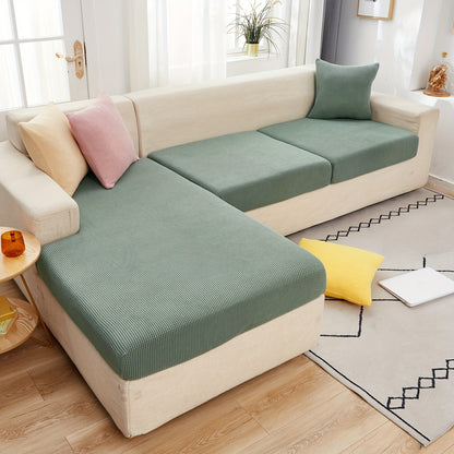 Durable sofa cover protects furniture from spills and stains.