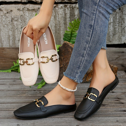 Flat mules with square toe and metallic buckle detailing, slip-on backless design, suitable for outdoor wear.