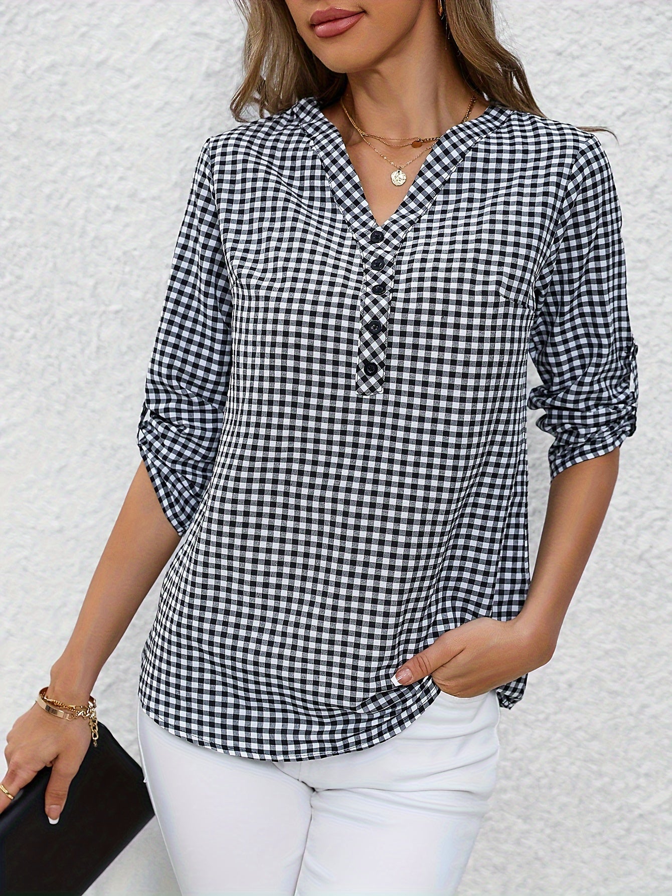 Women's yellow & white plaid button-up shirt with v-neck, long sleeves, and polyester fabric. Casual wear.